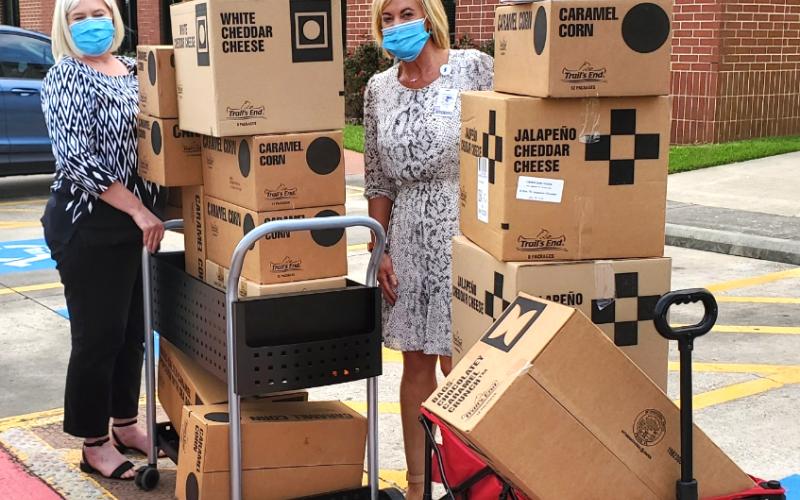 The Medical Center of Southeast Texas staff accepts boxes of donated popcorn from the Boy Scouts of America Three Rivers Council.