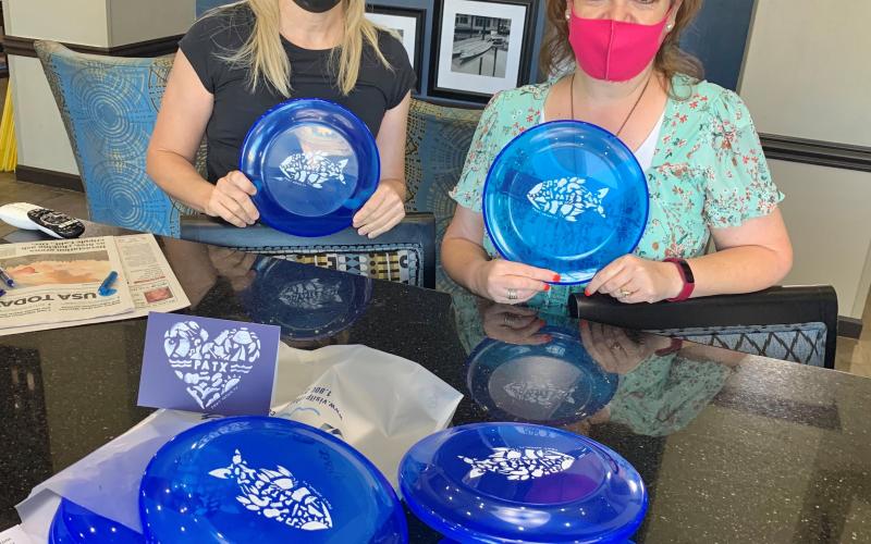 Elizabeth Giovannetti and Jennifer Allen of Hampton Inn &amp; Suites get a Housekeepers Week delivery from Port Arthur Convention &amp; Visitors Bureau. (Courtesy photo)