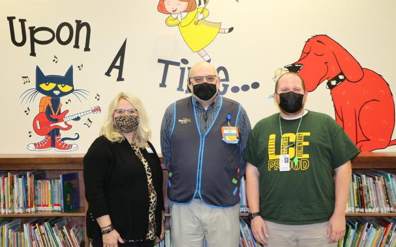 From left: LCE Principal Kayla Casey, West Orange Walmart Manager Hal Biskey and LCE Music Teacher Josh Leger