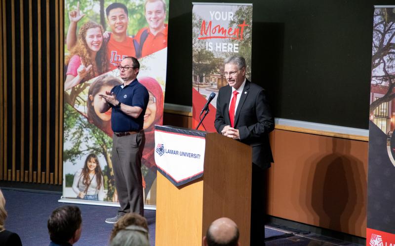 Taylor speaks during a campus visit in mid-June.