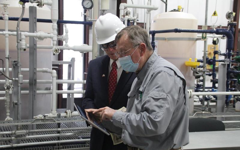Process technology/instrumentation director Earl Geis shows Congressman Brian Babin around the facility.