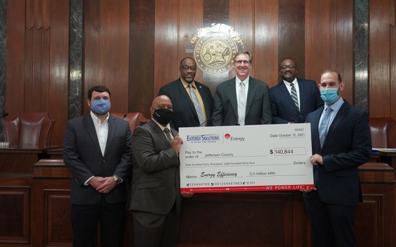 Pictured (bottom, L-R): Blake Flowers, Entergy Texas region customer service manager; Ron Fletcher, Entergy Texas customer service manager; Mark Delavan, Entergy Solutions program manager (top L-R) Commissioner Michael Sinegal; Judge Jeff Branick; and Commissioner Everette “Bo” Alfred