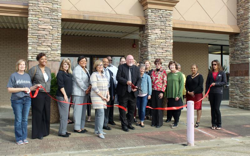Dr. Danny Lovett, executive director of Region 5 Education Service Center, cuts the ribbon, celebrating the opening of the Silsbee Education and Career Center. The ribbon cutting was sponsored by the Silsbee Chamber of Commerce.