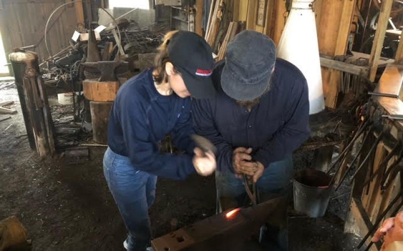 Sea Scouts learn blacksmithing.