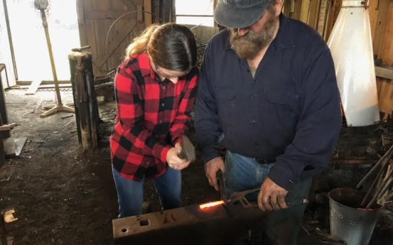 Sea Scouts learn blacksmithing.