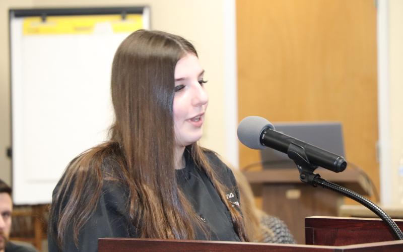 Brenna Wingate tells board members about her experience in Culinary Class.