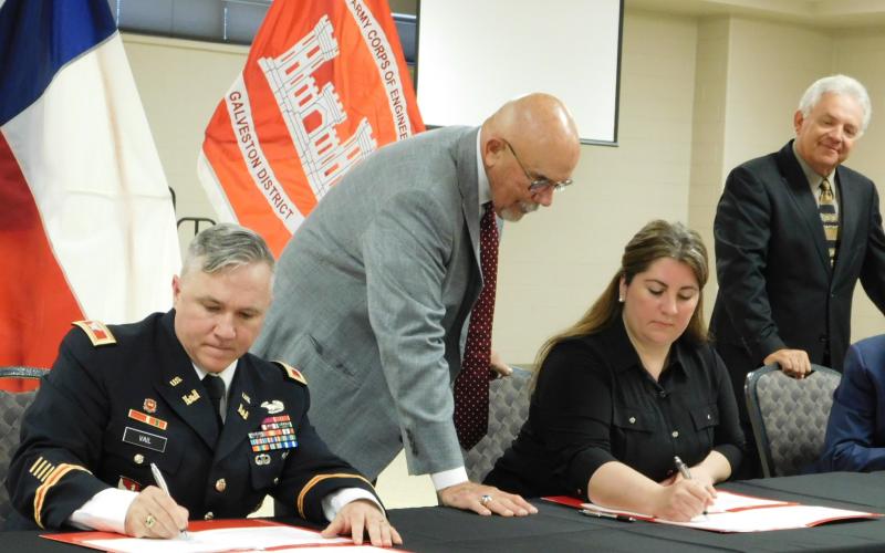 Photo cutline:  Col. Timothy Vail (far left) and Gulf Coast Protection District (GCPD) Executive Director Nicole Sunstrum (second from right) sign a partnership agreement for an Orange County flood mitigation project as Morgan’s Point Mayor and GCPD President Michel Bechtel (second from left) and Orange County Judge John Gothia (far right) watch.