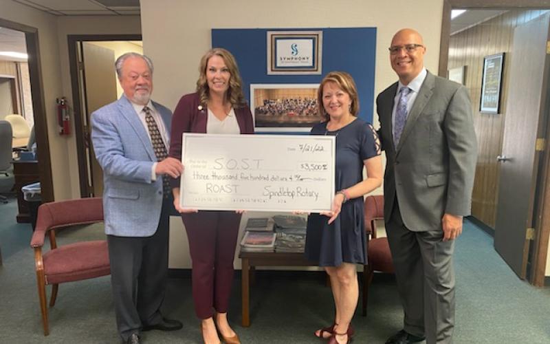 SOST Executive Director Doug Fair, 2021-22 Spindletop Rotary President Shannon Garrod, 2022-23 Spindletop Rotary President Micah Leigh and SOST Conductor Chelsea Tipton
