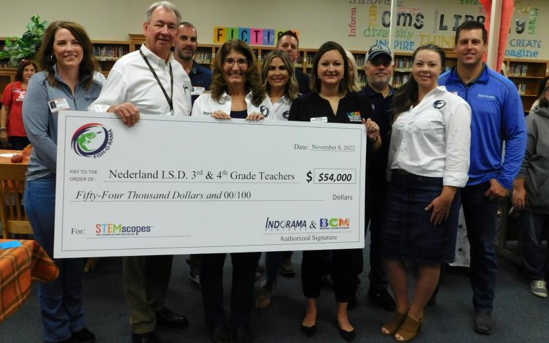 Indorama Ventures and Beaumont Children's Museum present Nederland ISD Superintendent Dr. Stuart Kieschnick with a $54k check for STEAM education.