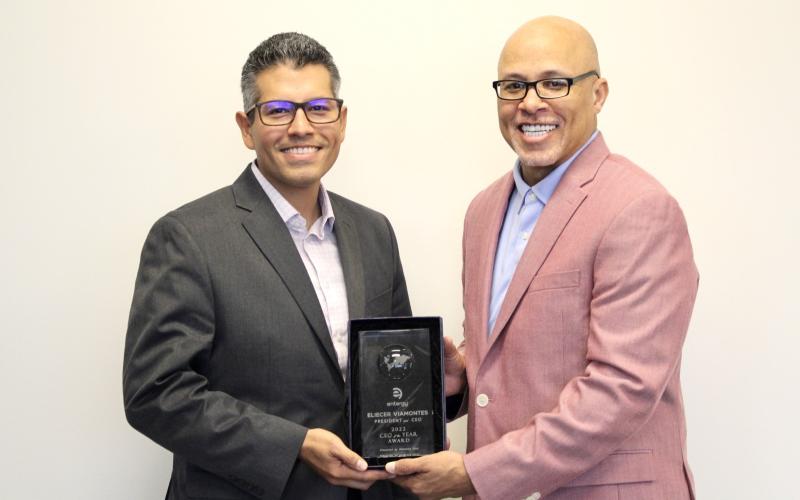 Entergy Texas President and CEO Eliecer 'Eli' Viamontes receives CEO of the Year award from Dennis Kennedy, founder and CEO of the National Diversity Council.
