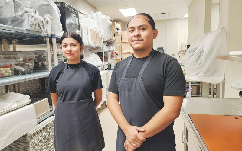 Memorial High School senior culinary arts students Temini Menor and Edwin Ayundis  join the PAISD Child Nutrition Staff.