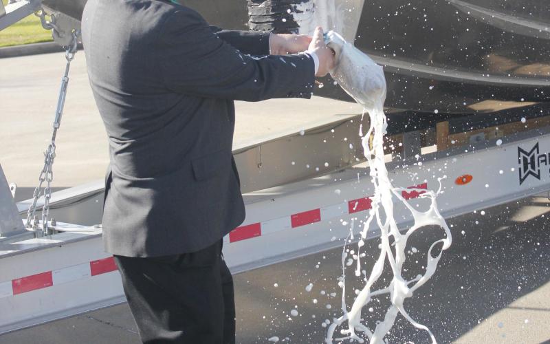LSCO President Dr. Tom Johnson christens the college’s new maritime training vessel. Photos | Dannie Oliveaux