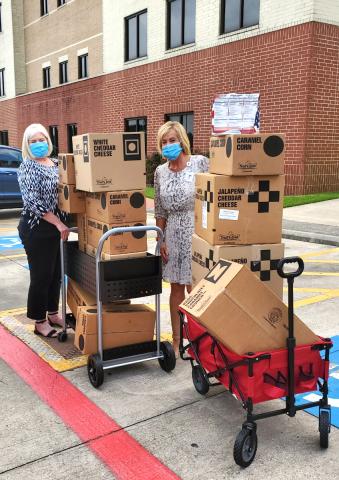 The Medical Center of Southeast Texas staff accepts boxes of donated popcorn from the Boy Scouts of America Three Rivers Council.