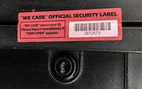 Safety seals on gas pump credit card readers should be unbroken, like the one pictured. A broken safety seal is a sign there could be a credit card skimmer at the pump.