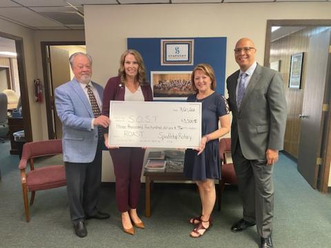 SOST Executive Director Doug Fair, 2021-22 Spindletop Rotary President Shannon Garrod, 2022-23 Spindletop Rotary President Micah Leigh and SOST Conductor Chelsea Tipton