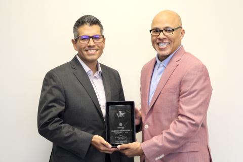 Entergy Texas President and CEO Eliecer 'Eli' Viamontes receives CEO of the Year award from Dennis Kennedy, founder and CEO of the National Diversity Council.