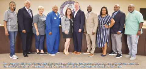 West Orange-Cove CISD Board of Trustees Linda Platt-Bryant, Tommy Wilson Sr., Gina Yeaman and Roderick Robertson; Natasha Garrett and Colin Garrett of G&G Enterprises; Superintendent Dr. Rickie Harris, and Trustees Tricia Stroud, Donny Teate Jr., and Demetrius Hunter