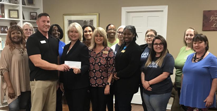 Beaumont Foundation presents check to Buckner