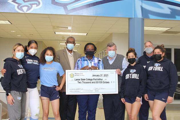 The Rotary Club of Port Arthur presented a $2,000 check to Lamar State College Port Arthur’s Athletics Department this past week to help pay for repairs to the Seahawks’ softball park, Martin Field, after damage. From left: Seahawks softball players Brianna Ramirez, Gabby Tims, Alexa Gracia, LeeAnn Hinojosa, Kaitlyn Samarripa and Coach Vance Edwards flank Rotary Club President Dr. Johnny Brown, Rotary Treasurer Delilah Francis, and LSCPA Director of Athletics Scott Street