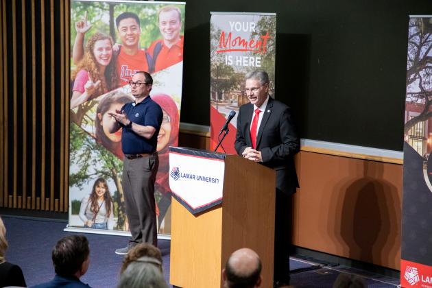 Taylor speaks during a campus visit in mid-June.