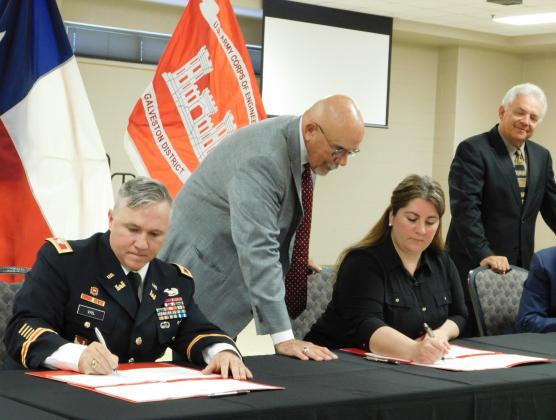 Photo cutline:  Col. Timothy Vail (far left) and Gulf Coast Protection District (GCPD) Executive Director Nicole Sunstrum (second from right) sign a partnership agreement for an Orange County flood mitigation project as Morgan’s Point Mayor and GCPD President Michel Bechtel (second from left) and Orange County Judge John Gothia (far right) watch.