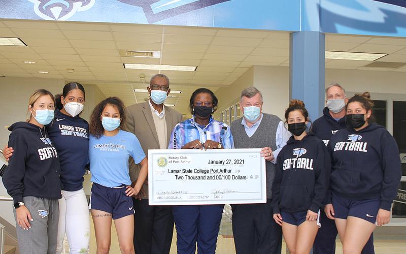 The Rotary Club of Port Arthur presented a $2,000 check to Lamar State College Port Arthur’s Athletics Department this past week to help pay for repairs to the Seahawks’ softball park, Martin Field, after damage. From left: Seahawks softball players Brianna Ramirez, Gabby Tims, Alexa Gracia, LeeAnn Hinojosa, Kaitlyn Samarripa and Coach Vance Edwards flank Rotary Club President Dr. Johnny Brown, Rotary Treasurer Delilah Francis, and LSCPA Director of Athletics Scott Street
