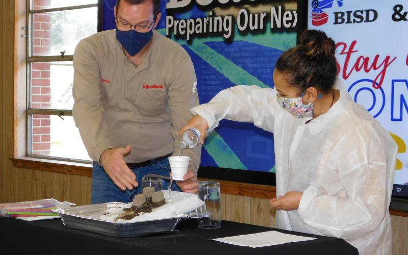 BISD K-8 Career Readiness Specialist Shamine Cormier demonstrates water erosion.