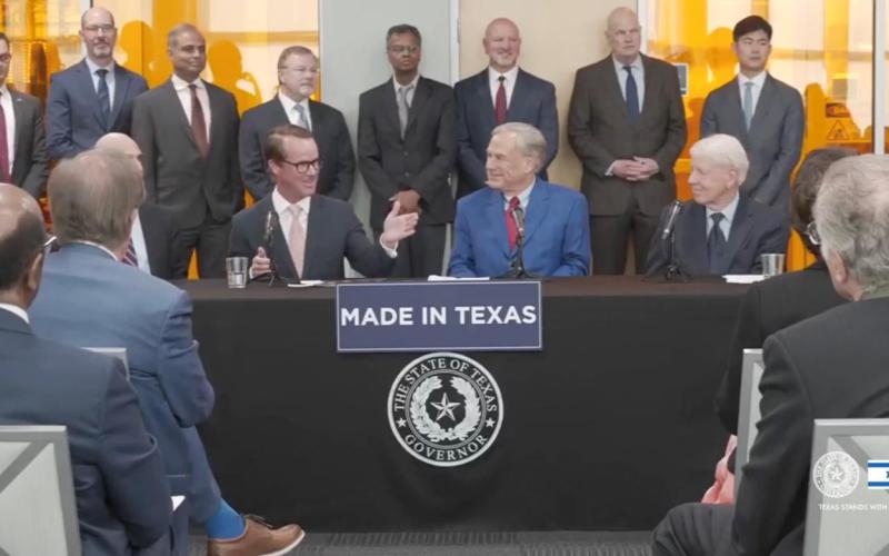 Speaker Dade Phelan, left of Gov. Greg Abbott, speaks during the March 19 announcement