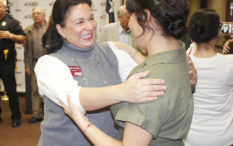 President and CEO Amy Lovoi, left, greets one of the guests during her welcome reception on Feb. 3. (Photo by Dannie Oliveaux)