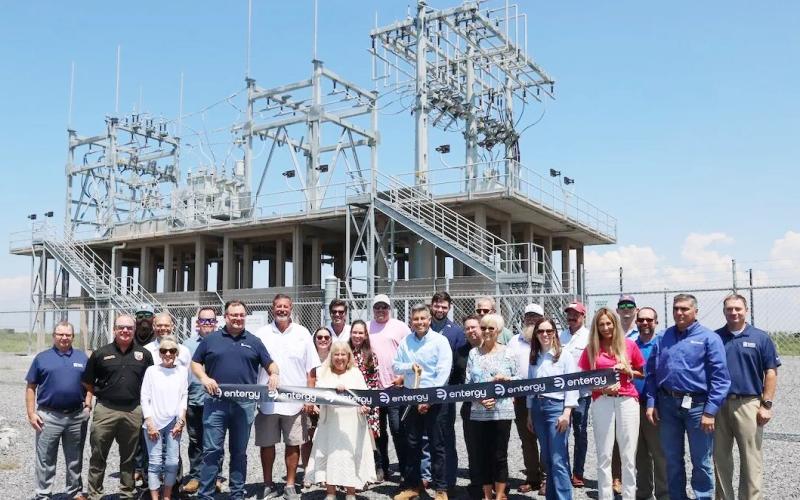 Entergy Texas leadership, employees, and community partners cut the ribbon at the new Port Bolivar substation, marking the completion of the Bolivar Peninsula Reliability Project.