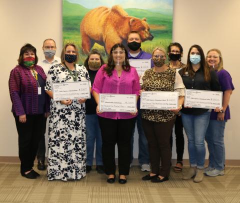 From left: LCM Superintendent Stacey Brister; LCI Principal Michael Ridout; Samantha Arrington; International Paper Representative Michelle Hatcher; Sommer Reynolds; Adam Strandberg; LCE Principal Kayla Casey; MMS Principal Kim Cox; International Paper Representative Stacey Nichols; and MVE Principal Carie Broussard. (Not pictured: Deidre Windham)