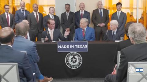 Speaker Dade Phelan, left of Gov. Greg Abbott, speaks during the March 19 announcement