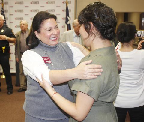 President and CEO Amy Lovoi, left, greets one of the guests during her welcome reception on Feb. 3. (Photo by Dannie Oliveaux)
