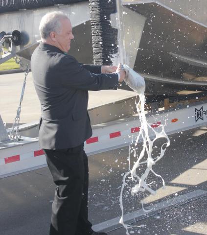 LSCO President Dr. Tom Johnson christens the college’s new maritime training vessel. Photos | Dannie Oliveaux