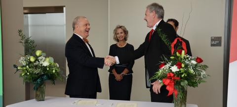 LCSO President Dr. Tom Johnson (left) and Lamar University President Dr. Jaime Taylor shake hands after signing a partnership agreement between the two schools. Looking on is LSCO Provost and Executive Vice President Dr. Wendy Elmore, the new LCSO president after Johnson’s retirement.