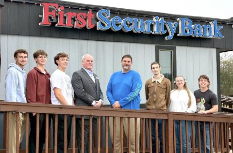 Standing with First Security Bank CEO Clint Walters and Mike Fogo, rocket instructor (center) are (from left) Hardin-Jefferson High School students Benjamin Harris, Grayson Sullivan, Kain Tinney, Westen Williams, Jayna Ivey and Tatum Brasseaux. Courtesy Image | First Security Bank